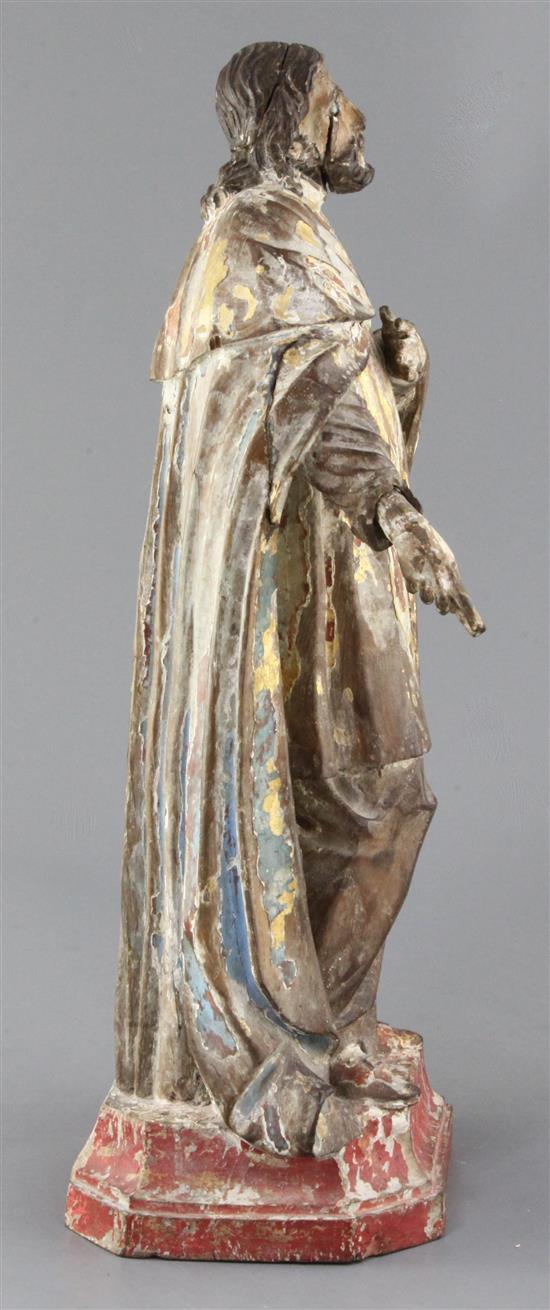 A Brazilian gilt and polychrome-painted carved wood figure of a saint, 18th century, height 17in.